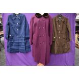 A 1960s purple wool coat with faux fur collar and two 1960s short Mac style coats, one navy the