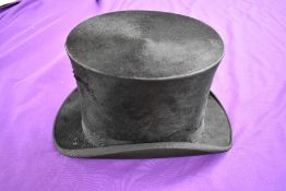 An antique top hat 'R.W.T.K Thompson Kendal' internal measurement approx 21' height approx 5.5',some