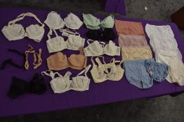 A collection of ladies vintage and retro underwear and lingerie including nylon knickers and bras.