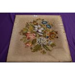 A Victorian wool embroidered panel having floral pattern and bead work detailing.