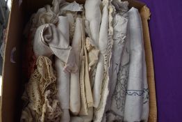 A box of vintage and antique table linen and similar, embroidered and damask examples included.