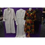 A mixed lot of clothing including 1960s wedding dress with lace detailing,tartan wool 1940s dress,