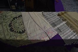 A selection of vintage and antique shawls, various styles and era, fabrics and designs, also