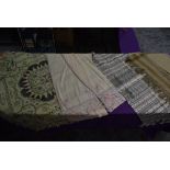 A selection of vintage and antique shawls, various styles and era, fabrics and designs, also