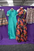A collection of vintage dresses and skirts including vibrant floral halter neck Tina Warren dress