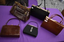 A selection of vintage clasp top handbags.