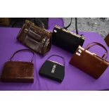 A selection of vintage clasp top handbags.