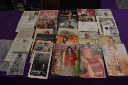 A collection of vintage knitting magazines.