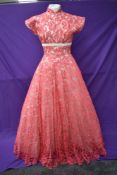 A vintage late 50s/60s pink lace dress having cream velvet band to under bust, tapered bodice into