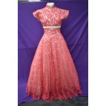 A vintage late 50s/60s pink lace dress having cream velvet band to under bust, tapered bodice into