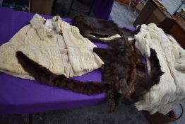 A box of vintage furs for make do and mend or repair including an ermine cape having Harrods label.