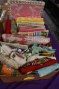 A box full of vintage and retro towels, tea towels,oven gloves and aprons including novelty and