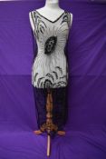 A superb example of a 1920s tulle tabard dress having extensive and intricate beading and sequin