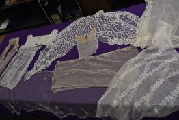 A lot containing sections and panels of lace, tulle and similar most appear to have been removed