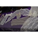 A lot containing sections and panels of lace, tulle and similar most appear to have been removed