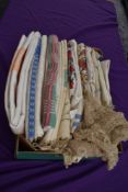 A box full of vintage table linen and similar including damask, embroidered and novelty table cloths