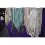 A collection of vintage and antique shawls including mint green fringed shawl,another of silk having