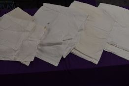 A selection of vintage white flat sheets.