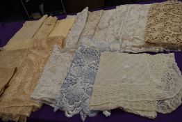 A large lot of vintage crotchet/net curtains,sections panels and settee backs.