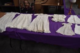A selection of antique baby clothing including gowns and undergarments,cardigan and more, some