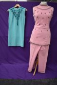 A wonderful baby pink 1960s wool trouser suit with beading and rhinestones to tunic top and