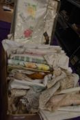 A large quantity of vintage table linen including boxed damask tray cloth and embroidered examples.