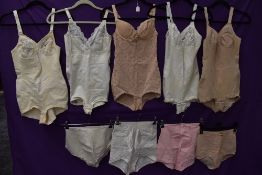 A collection of vintage corselettes and girdles.