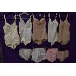 A collection of vintage corselettes and girdles.