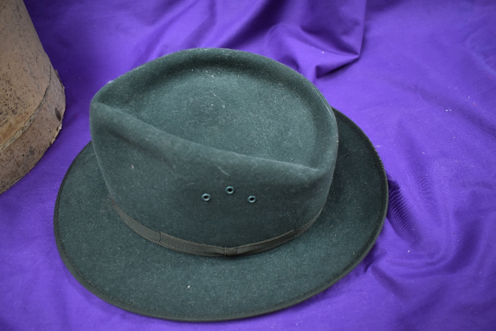 A vintage green felt trilby with hat box.