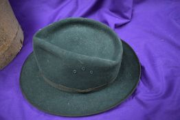 A vintage green felt trilby with hat box.