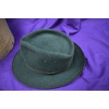 A vintage green felt trilby with hat box.