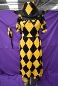 A scarce antique ladies jesters outfit with hat and spinning/musical doll on stick with spare