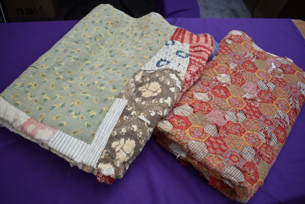 Two colourful antique patchwork quilts, both having damage.