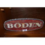 A cast iron Boden truck or similar motor sign