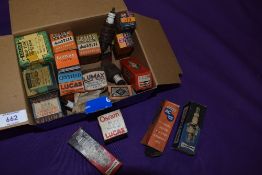 A collection of vintage spark plug and light bulb display boxes.