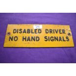 A vintage 'Disabled driver, no hand signals' plate