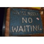 A vintage cast metal sign for No Waiting Police Notice