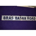 A vintage road side enamel sign reading Bras Basah Road