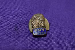 A Guy motors lapel badge.