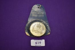 A Duckhams oild commemorative coin or medallion