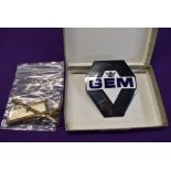 A motor car engine badge for GEM motoring assist