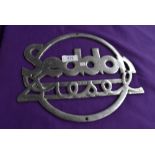 A large original Seddon diesel radiator badge.