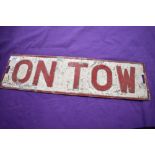 An 'ON TOW' plate