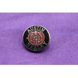 An Austin Healey Lapel badge.