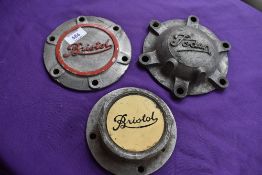 Three vintage lorry hub caps, including Bristol.