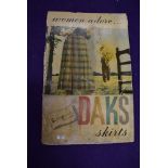 A vintage dress makers shop window advertising sign for DAKS Skirts