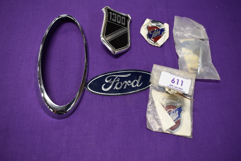 A selection of motor car engine badges for Ford Ghia