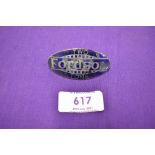 A vintage enamel motor truck badge reading Fordson Two Tons