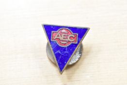 An AEC lapel badge.