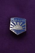 An Albion lapel badge.